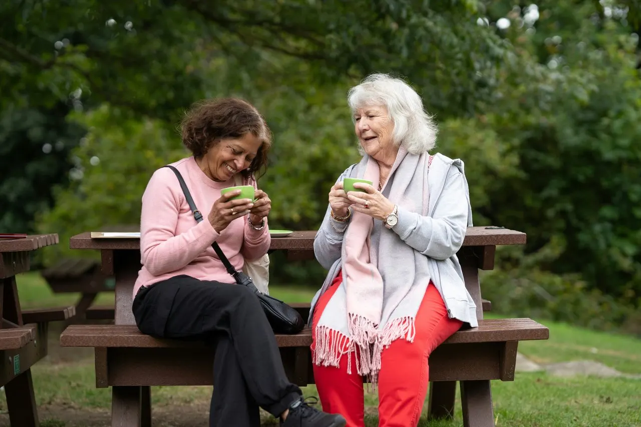 Two friends enjoying a relaxed afternoon outdoors