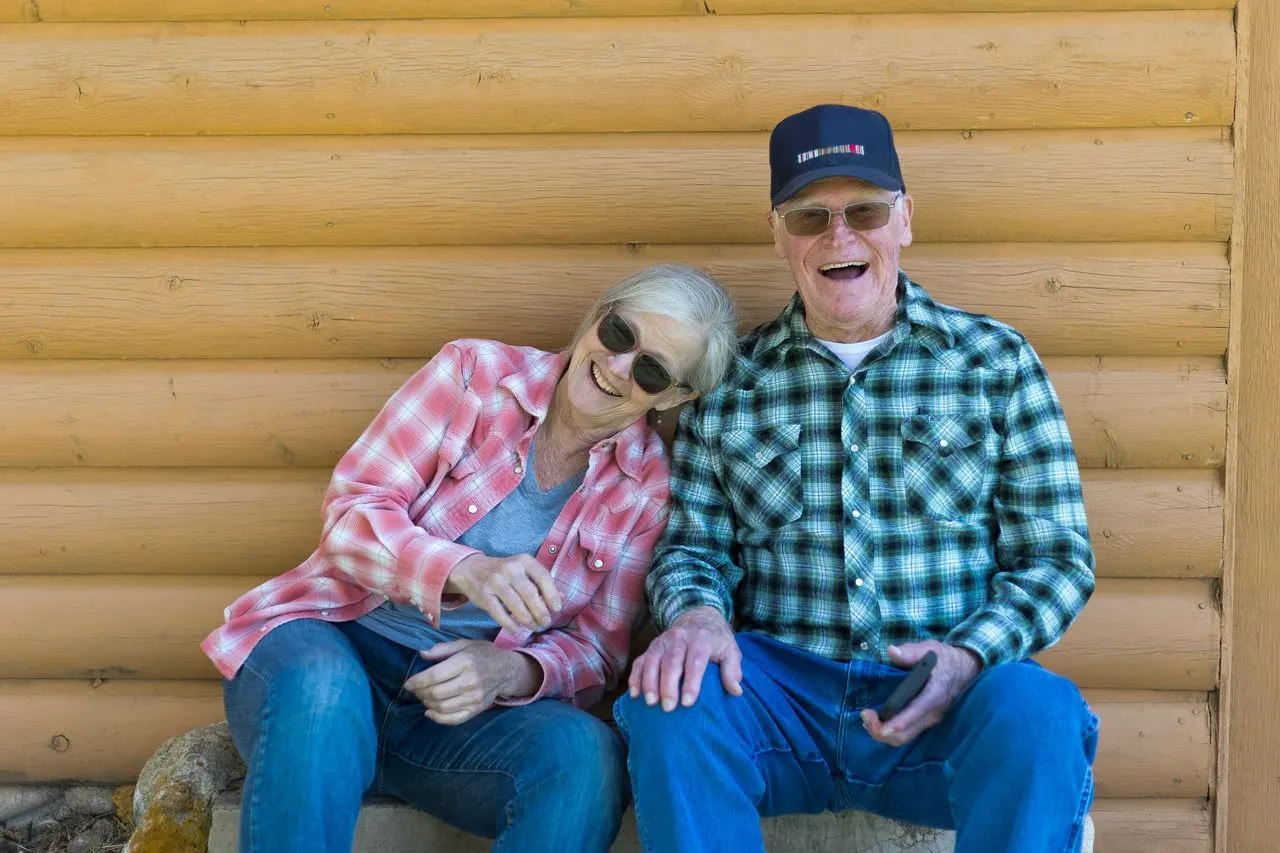 A couple laughing together on a trip